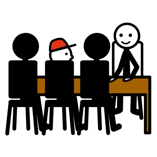 La imagen muestra cuatro personas sentadas trabajando en equipo