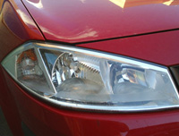 Faro proyector de superficie compleja.