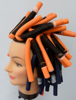 Cabeza de maniquí con los bodys puestos en espiral y vertical.