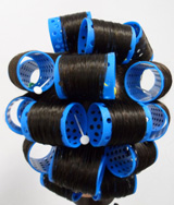 Cabello de maniquí, enrollado con la técnica de enladrillado.